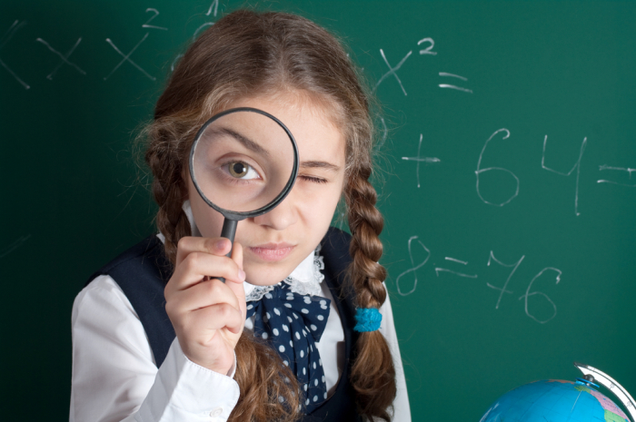 Imgage of girl with magnifying glass